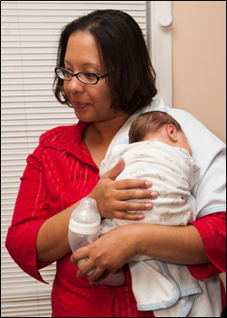 YFT staff member with infant